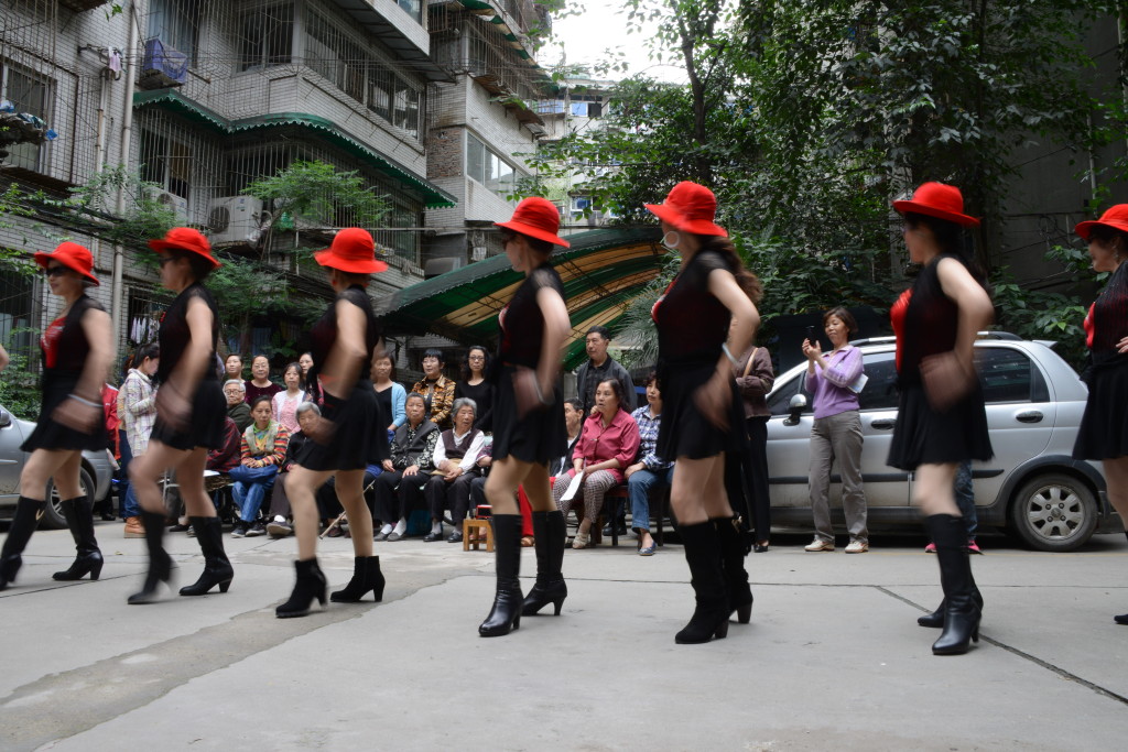 A group of volunteers from a local NGO called I YOU SHE performing for elderly residents in a residential compound in Chengdu, Sichuan Province.  © Tong Lam